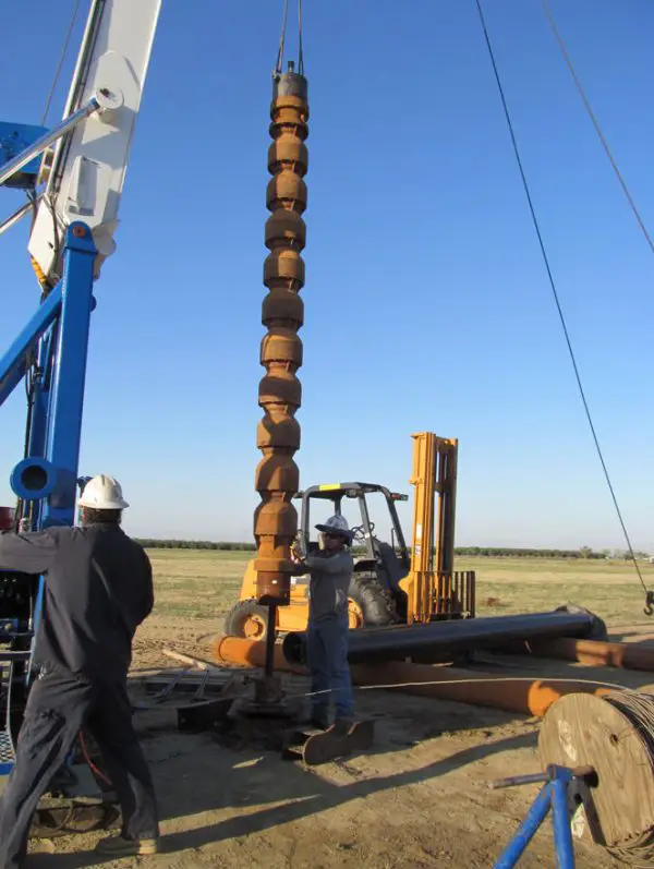 Thomas Harder Company Workers working on a well.